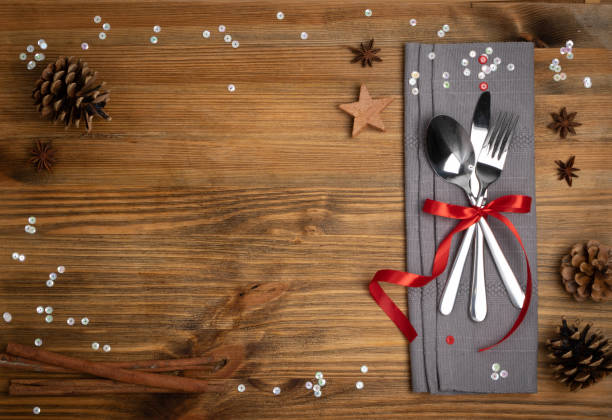 istock Christmas Dinner Table Setting with Cutlery and Winter Spices 1204354868