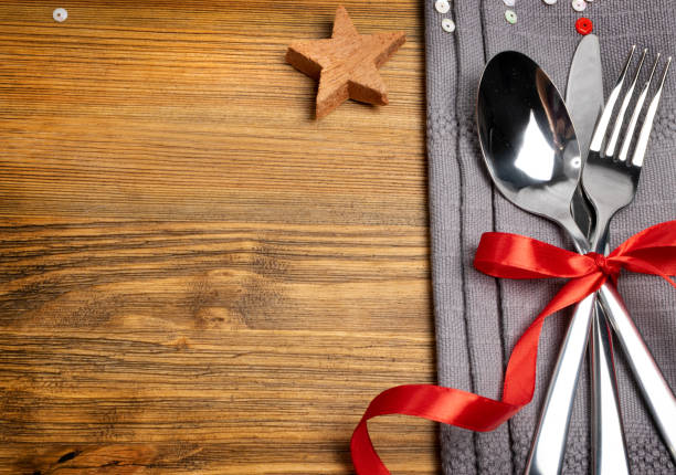istock Christmas Dinner Table Setting with Cutlery and Winter Spices 1204354873