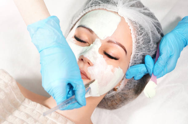 cosmetic face mask treatment. beauty treatments. - exfoliating scrub imagens e fotografias de stock