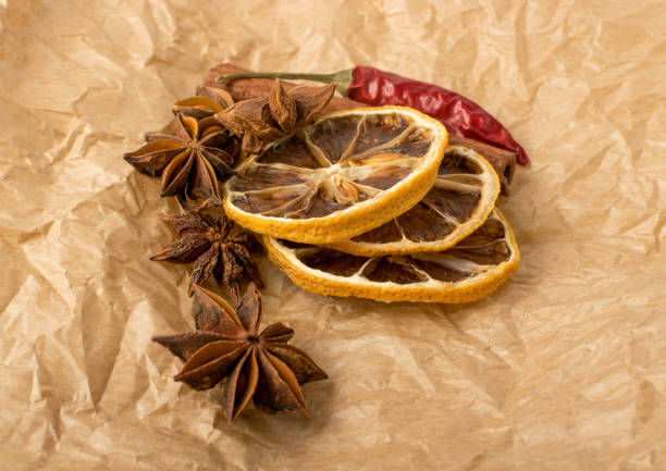 christmas spices, nuts, cookies and dried fruits on bokeh background