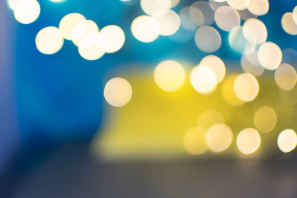 istock Abstract Yellow Bokeh Circles on Blurred Background 1204359271