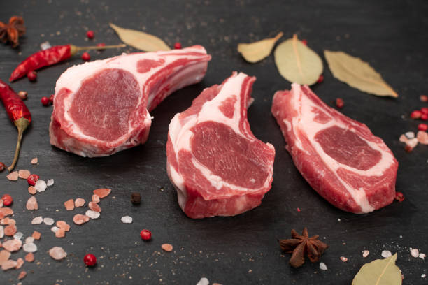 istock Raw Lamb Chops, Mutton Cuts or Sheep Ribs on Black 1204359291