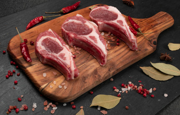 istock Raw Lamb Chops, Mutton Cuts or Sheep Ribs on Black 1204359295