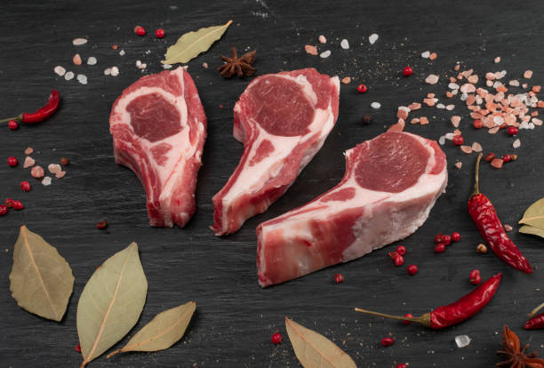 istock Raw Lamb Chops, Mutton Cuts or Sheep Ribs on Black 1204359297