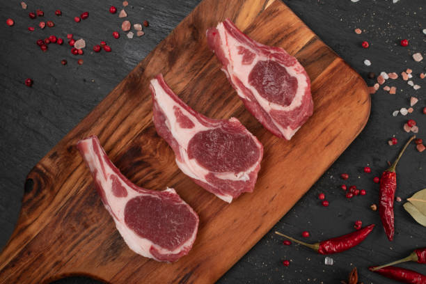 istock Raw Lamb Chops, Mutton Cuts or Sheep Ribs on Black 1204359300