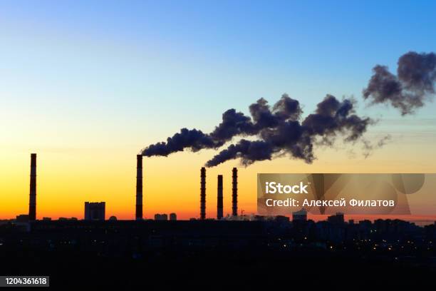 Pipes Smoke Factories At Sunset Stock Photo - Download Image Now - Coal, Fumes, Thermal Power Station