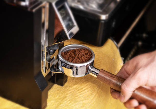 istock Macro shot grinding coffee on professional grinder machine 1204366615