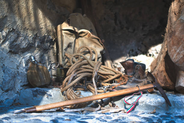 istock Ancient mountaineering material. Rope ice ax crampons 1204370079