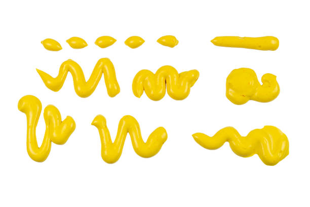 istock Yellow cheese sauce splashes isolated on white background. 1204370453