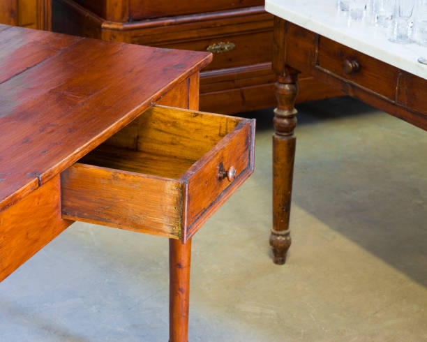 istock Old italian wooden table just restored with open drawer 1204371669