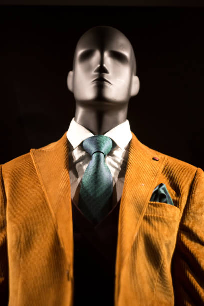 istock Plastic male mannequin at night in clothing store window 1204371767