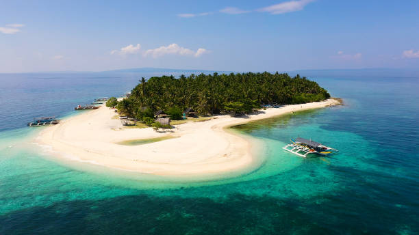 istock Tropical island on a coral reef, top view. Digyo Island, Philippines 1204372690