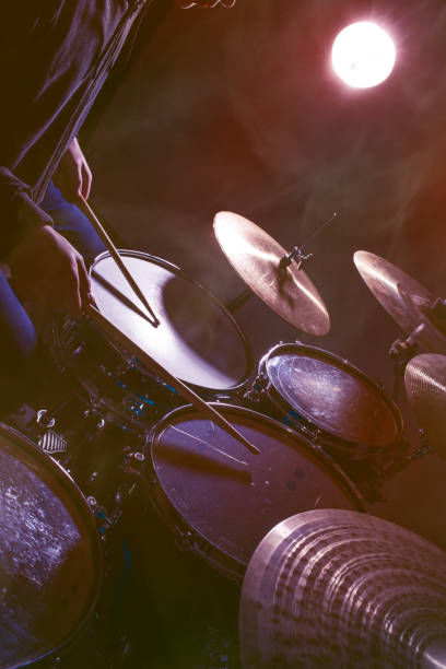 istock The man is playing drum set in low light background 1204373131
