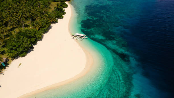 istock Tropical island on the attole, top view. Mahaba Island, Philippines 1204373253