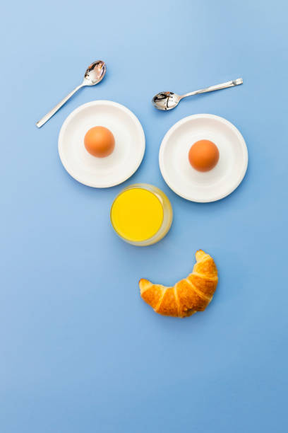 istock Funny breakfast concept with abstract emotional human face 1204374133