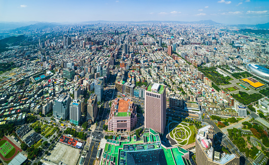 Aerial panorama over the highrise housing, skyscrapers and crowded cityscape of central Taipei, Taiwan’s vibrant capital city.