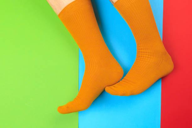 istock legs in colorful socks on colorful  background 1204375298