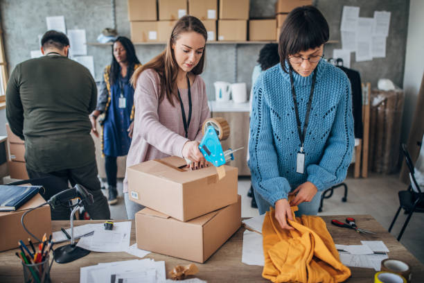istock Diverse group of people arranging customers orders for drop shipping 1204375363