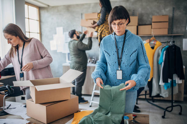 istock Diverse group of people arranging customers orders for drop shipping 1204375429