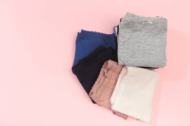 istock Female panties over pink  background 1204375611