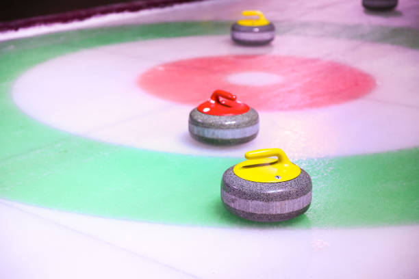 istock curling stones on ice near the home 1204379466