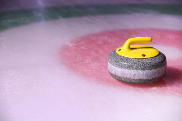 istock curling stone on ice near the home 1204379602