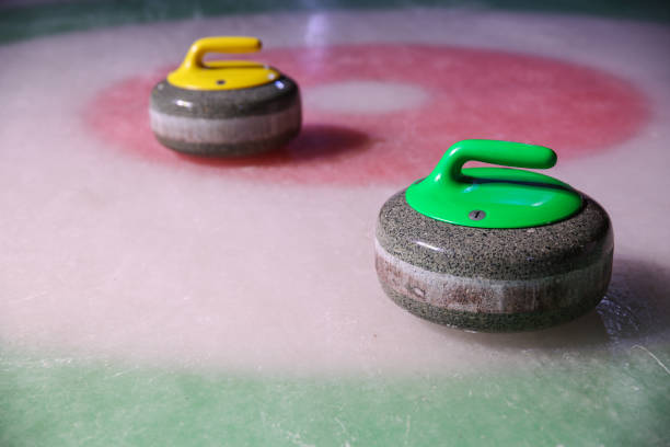 istock curling stones on ice near the home 1204379612