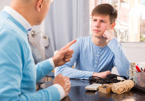 istock Father lecturing his teenage son 1204379622
