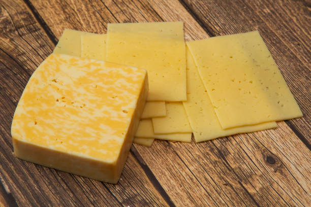istock Cheese on a wooden background. 1204379983
