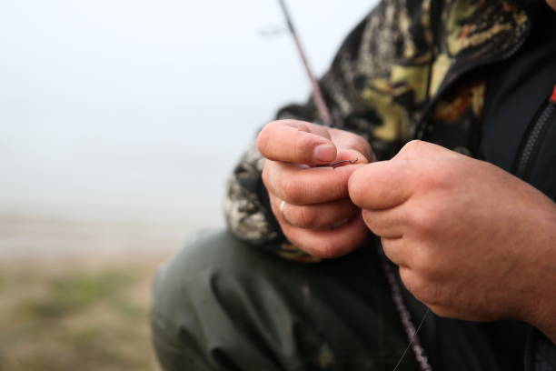 istock fisherman preparing fishing tackles 1204381502
