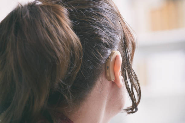 istock Deaf woman wearing hearing aid 1204383080