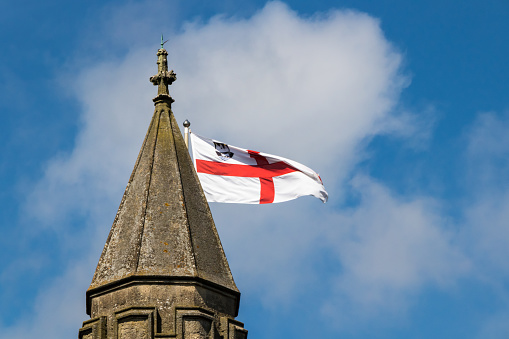 St George's flag flying from the top of a church spire