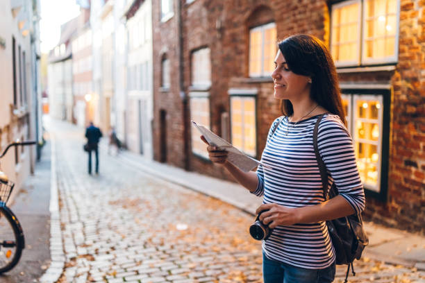 istock Woman exploring Lubeck old town 1204385554