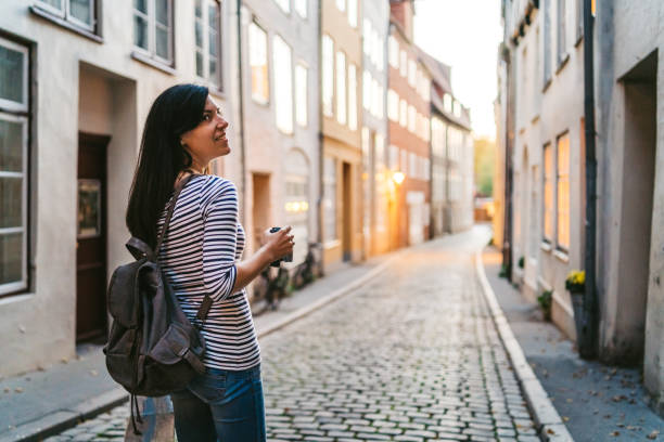 istock Woman exploring Lubeck old town 1204385563