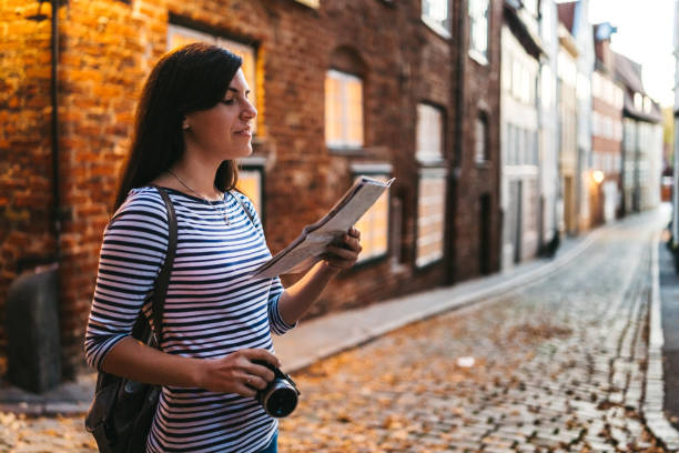 istock Woman exploring Lubeck old town 1204385571