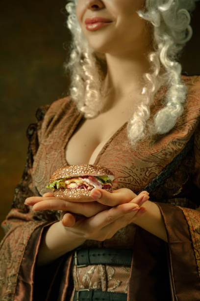 istock Medieval young woman in old-fashioned costume 1204387385