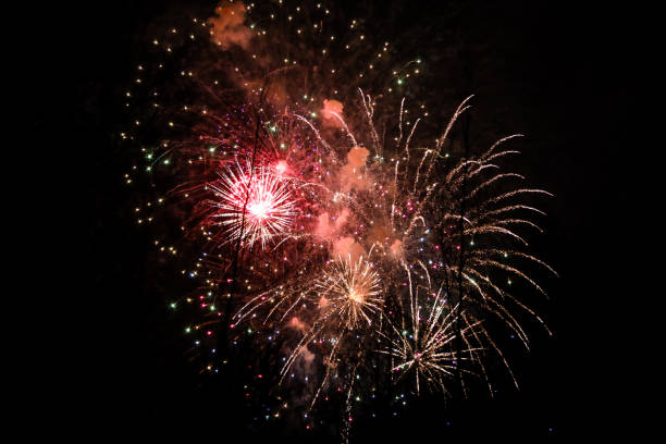 istock Beautiful new years firework celebration in black evening sky. 1204387784
