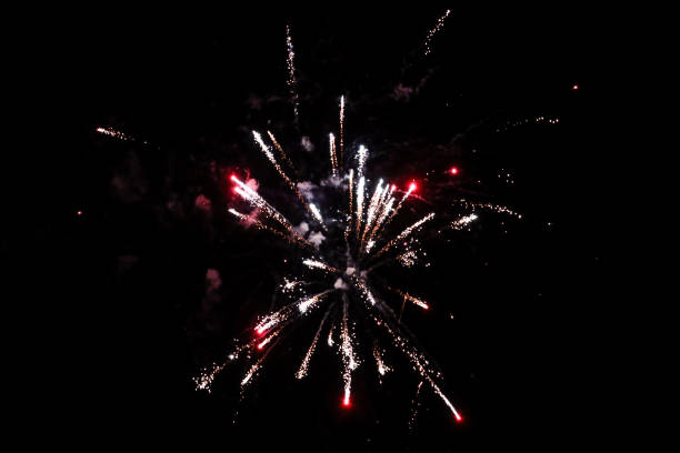 istock Beautiful new years firework celebration in black evening sky. 1204387787