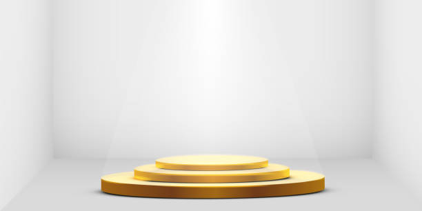 istock Round golden podium, pedestal or platform illuminated by spotlights on white background. Platform for design. Realistic 3D empty podium. Stage with scenic lights 1204388590