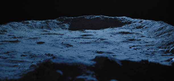 istock Barren lunar surface and crater 1204389056