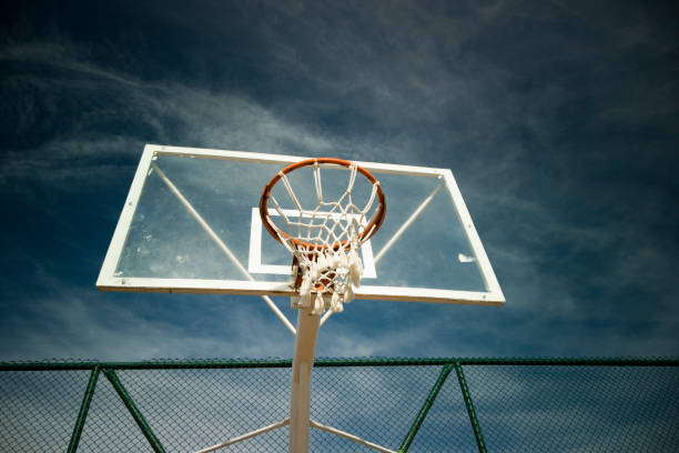istock Basketball rim amazing shot with sky 1204391095