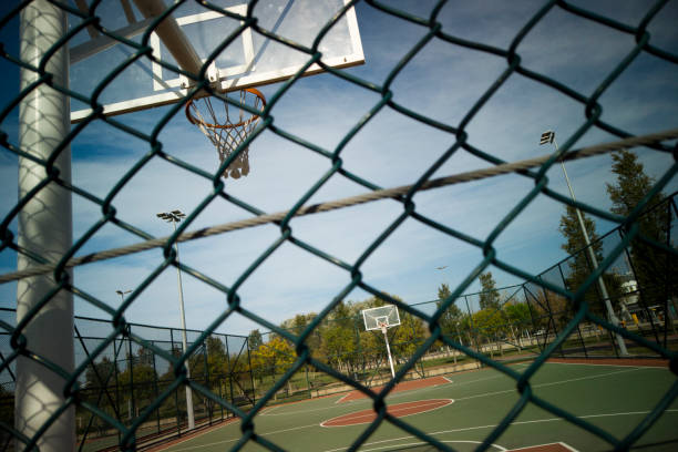 istock Basketball rim amazing shot with sky 1204391646