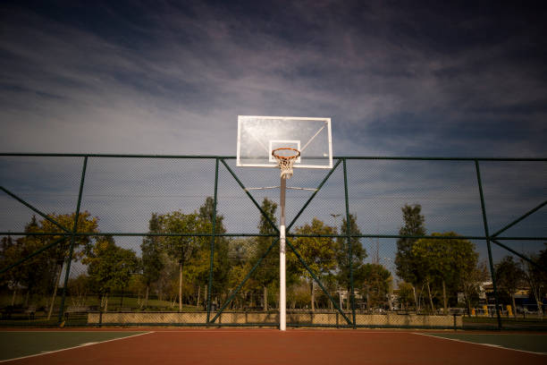 istock Basketball rim amazing shot with sky 1204391656