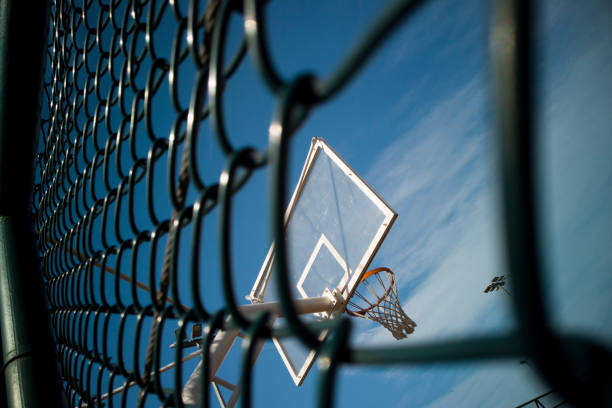 istock Basketball rim amazing shot with sky 1204391698