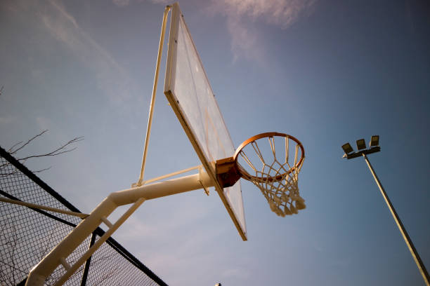 istock Basketball rim amazing shot with sky 1204391728