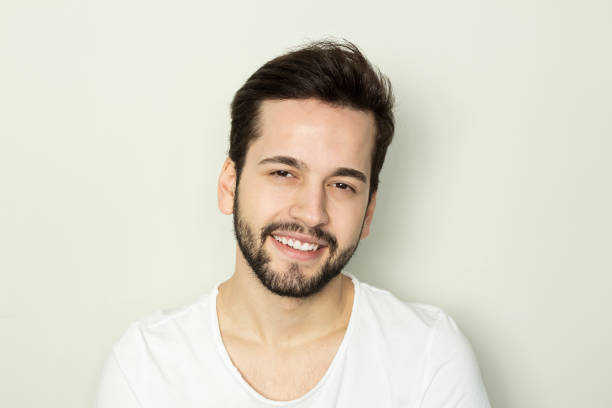 istock portrait of an handsome man smiling 1204391994