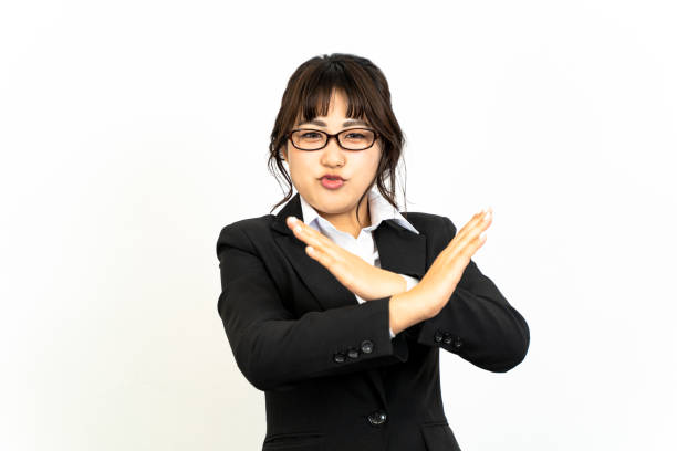istock Woman doing bad sign 1204392564