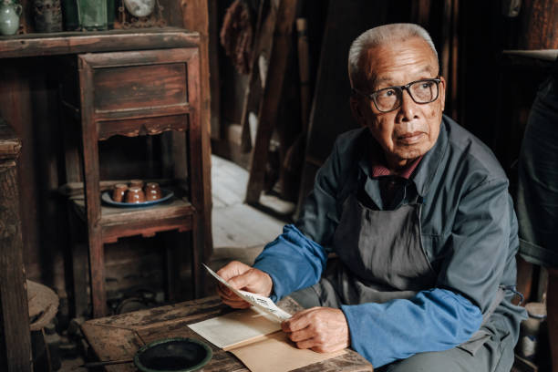 istock Chinese senior man using mobile phone 1204393342