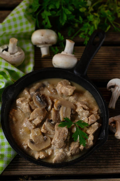istock Slow cooked pork stew with mushrooms in creamy sauce 1204393397