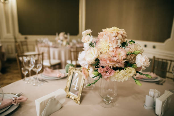 istock Elegant classic table set.  Lovely wedding decor with fresh flowers and table number. 1204393411